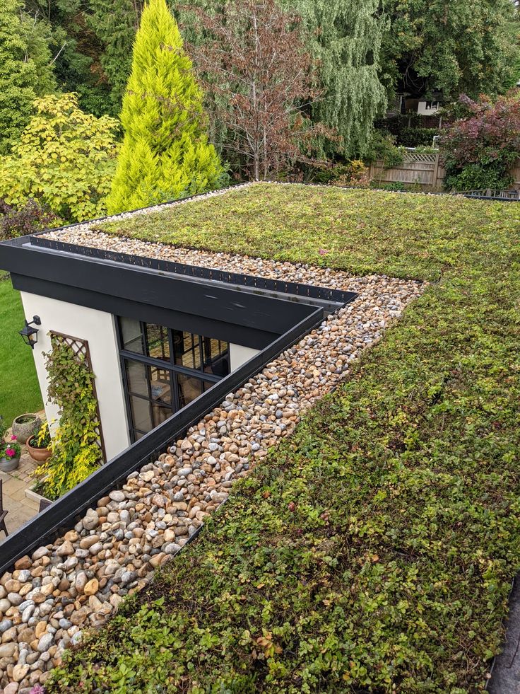 a green roof with rocks and grass on it