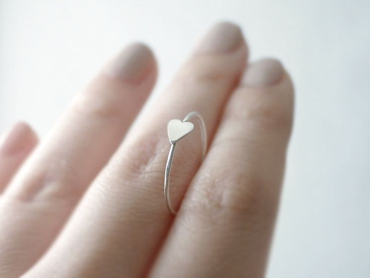 Silver heart ring - sideways heart - delicate and dainty illusy jewelry. $25.00, via Etsy. Dainty Adjustable Tiny Heart Ring, Simple Heart-shaped Stackable Rings As Gift, Minimalist Heart Charm Ring For Everyday, Simple Heart-shaped Stackable Rings For Gifts, Minimalist Heart Charm Ring For Everyday Wear, Simple Heart Shaped Stackable Rings For Gifts, Minimalist Midi Rings With Heart Charm For Promise, Dainty Heart Ring For Everyday, Dainty Tiny Heart Ring For Everyday