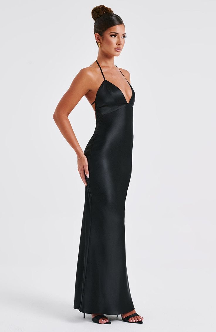 From engagement party to chapel ceremony, whatever the dress code, wear Delphine for every special occasion. Crafted in our premium non-stretch satin with a beautiful sheen, this maxi dress has a plunge halter neckline, super low scoop back with delicate elastic straps. Wear with a chic, undone hair up and metallic accessories. 



Colour: Black.

Premium non-stretch satin.

Plunge halter neckline.

Hook closure on neck.

Elastic straps to back.

Low scoop back.

Invisible zipper to reverse.

Ma V Neck Satin Dress, Homecoming Dresses Corset, Midi Dress Wedding Guest, Backless Maxi Dress, Spaghetti Strap Maxi Dress, Maxi Dress Sale, Bodycon Maxi Dresses, Sparkle Dress, Backless Maxi Dresses