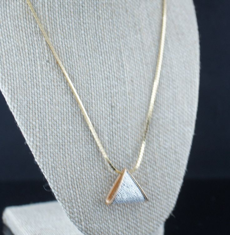 This is the perfect option for those who like cool, unique jewelry and the luxury, shine of gold, white. This set is well made, cute and/or elegant in design, and very desirable. The necklace has a box design. The necklace has a pendant. The shape of the pendant is a triangle. This pendant is decorated with 3 clear CZ, and it has a diamond-cut design. The clasp is in good working condition. ♥ Age/era: Circa 1970s - 1980s. ♥ The necklace has a hallmark. It is sterling 925.Lirm. The pendant has a Luxury White Diamond-shaped Jewelry, Gold Diamond-shaped Jewelry With Diamond Accents, Gold Jewelry With Diamond Accents In Diamond Shape, White Diamond-shaped Jewelry Gift, White Snake Chain Jewelry Gift, Modern Gold Jewelry With Trillion Cut, Modern Gold Trillion Cut Jewelry, White Gold-plated Jewelry With Diamond Cut, White Gold Plated Jewelry With Diamond Cut