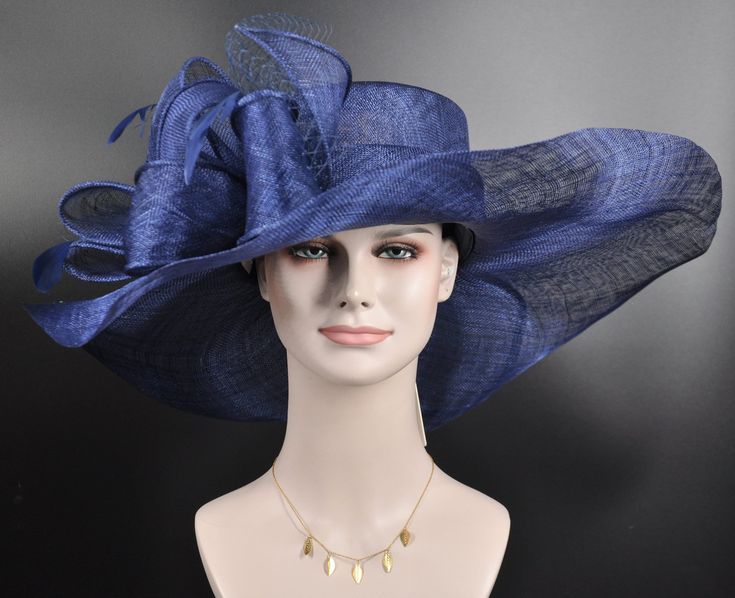 "The oversized brim adorned with a jumbo sinamay bow in and feathers  design characterizes this horse racing event hat made of natural straw. The large brim creates a statement piece, and the sinamay jumbo bow  and netting adds a touch of whimsy and feminine elegance. Crafted from straw, it exudes a light and airy feel, making it a stylish and comfortable choice for a day at the races. The hat combines the classic appeal of a wide brim with the playful charm of a jumbo sinamay bow and netting , Feathered Hat For Royal Ascot Races, Royal Ascot Hats With Feather Trim, Chic Feathered Hat For Races, Kentucky Derby Wide Brim Top Hat With Feather Trim, Wide Brim Feathered Hat For Royal Ascot, Royal Ascot Fedora Costume Hats And Headpieces, Sinamay Costume Hats For Royal Ascot Races, Royal Ascot Race Elegant Hat, Oaks Day