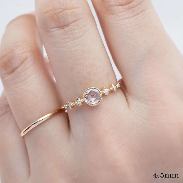 ✦ Current Inventory✦ 0.10ct yellow gold ring and 0.30ct yellow gold ring are in-stock in size 7. These will ship immediately in size 7, other sizes require 10 days to resize. Everything else is made-to-order and it takes 4 weeks. ✦ Main listing photo features 4.5mm diamond ring ✦ Video features top: 0.16ct diamond and bottom: 0.30ct Diamond ✦ Focal stone: natural rose-cut diamond ✦ GIA cert is optional 200) ✦ Bandwidth: approx. 1.4mm ✦ Accented with 0.05ctw natural earth-mined diamonds ✦ Low profile bezel setting ✦ Recycled solid 14k gold ✦ Packaged in a velvet ring box ✦ Handmade in NYC❤️ ✦ Buy this ring and receive 5% off coupon on your next purchase! 💎Focal Stone Size ✦ Near colorless, VS clarity, eye clean ✦ ≈4.0mm ≈0.10-0.20ct ✦ ≈4.5mm ≈0.20-0.30ct ✦ ≈5.0mm ≈0.30-0.35ct ✦ Please inqu Delicate Promise Ring With Rose Cut Diamonds, Delicate Rings With Rose Cut Diamonds, Delicate Rose Cut Promise Diamond Ring, Delicate Birthstone Ring With Rose Cut Diamonds, Delicate Rose Cut Diamond Birthstone Ring, Delicate Rose Cut Diamond Birthstone Ring For Wedding, Delicate Wedding Ring With Rose Cut Diamond Birthstone, Dainty Promise Birthstone Ring With Rose Cut Diamonds, Dainty Gold Crystal Ring With Rose Cut Diamonds