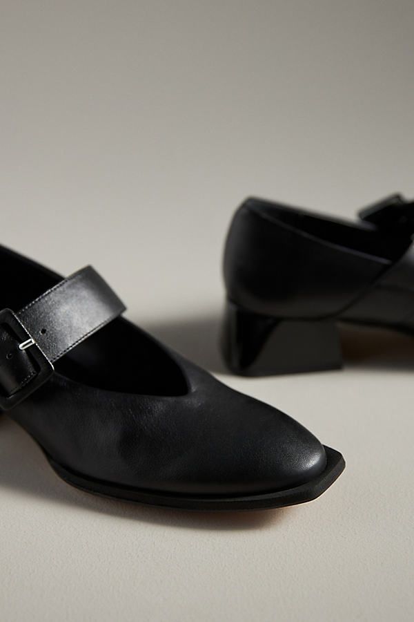 Leather upper, insole Rubber sole Buckle styling Imported | Muluya Mary Jane Heels by Paloma Barcelo in Black, Women's, Size: 39, Leather/Rubber at Anthropologie Leather Court Shoes With Heel Strap And Square Toe, Mary Jane Heels With Ankle Strap And Leather Sole, Leather Mary Janes With Padded Heel And Ankle Strap, High Heel Leather Mary Janes For Spring, Leather High Heel Mary Janes With Padded Heel, Leather High Heel Mary Janes For Spring, Chic Mary Janes With Padded Heel And Closed Toe, Chic Closed-toe Mary Janes With Padded Heel, Spring Court Shoes With Leather Sole And Ankle Strap