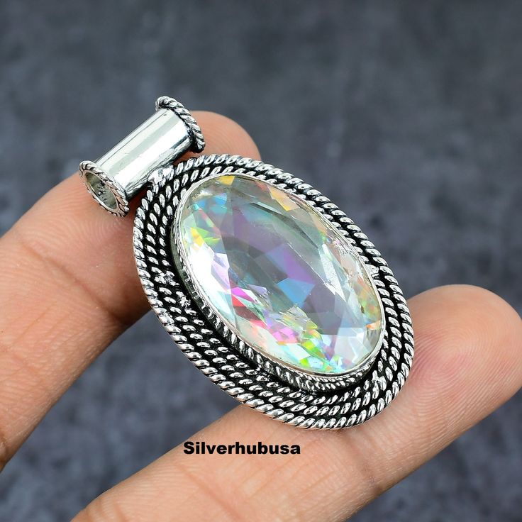 Natural Mystic Topaz Pendant, 925 Sterling Silver Pendant, Boho Pendant, Gemstone Pendant, Handmade Jewelry, Rainbow Pendant, Mystic Jewelry. ITEM DESCRIPTION -  Gemstone : Natural Mystic Topaz Material : 925 Sterling Silver PENDANT DESCRIPTION - Length : 30 mm Width : 16 mm Occasion : Birthday Events, Lovely Valentine's Day Gift, Anniversary Gift, Weeding Gift, Engagement Ring, Lover Gift Ring, Hen Party And Other Occasion.... Shop Policies for Silverhubusa Shipping profiles Your order will be handmade and ready for shipment in 3 to 5 business days Normally we ship via UPS it takes 1 to 11 days if you need faster delivery You can select Shipping in your cart. We are manufacture, supply, wholesale a  Other Shipping Courier (United States Only) - ( 1 To 11 BUSINESS DAYS TO BE ARRIVED) - Fre Mystical Silver Gemstone Crystals, Mystic Topaz Jewelry, Mystical Necklace, Mystical Jewelry, Boho Pendant, Mystic Topaz, Handmade Pendants, Gifts For Mum, Gemstone Pendant