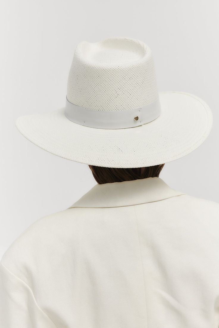 Details A classic fedora style made with packable straw. The structured fit creates a beautiful modern shape while staying true to the timeless design of our classic fedora. This effortless piece can easily be worn year-round and is meant for traveling with you wherever you go. · Brim: 3.75"· Crown: 5"· 1.25" Tonal Leather Band· Gold Screw Closure· Made in the USA· UPF 45+ Fit Runs true to size. If between sizes, we suggest sizing up. Fedora Style, Packable Hat, Leather Band, Innovation Design, Fedora, Timeless Design, Screw, Bleach, Straw