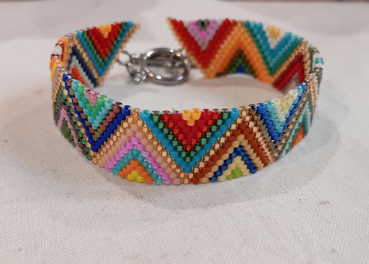 Lightweight and easy to wear multi-color woven bead bracelet. It goes with all your outfits thanks to its wide mix of colors. On T clasp, design and elegant. Elegant Multicolor Bracelets For Festival, Adjustable Multicolor Woven Cuff Bracelet, Adjustable Woven Multicolor Cuff Bracelet, Trendy Multicolor Braided Bracelets, Unique Multicolor Woven Beaded Bracelets, Casual Multicolor Braided Bracelets With Round Beads, Unique Multicolor Tiny Bead Bracelets, Festival Multicolor Braided Bracelets With Tiny Beads, Multicolor Braided Bracelets With Round Beads For Summer