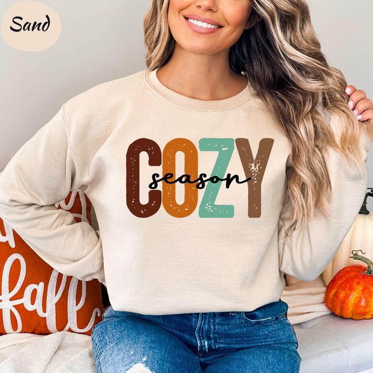 Get ready for the cozy season with this retro-inspired fall graphic tee! Our women's fall sweaters are perfect for sweater weather and will have you feeling comfy and stylish all season long. This cozy season sweatshirt is the perfect addition to your fall wardrobe, featuring a classic design that exudes autumn vibes. Treat yourself to our women's fall shirt and stay warm and chic this season. Embrace the fall spirit with our Get Cozy sweatshirt and elevate your autumn style effortlessly! 🛒 How Retro Soft-washed T-shirt For Fall, Retro Cotton Sweater For Fall, Trendy Soft-washed Hoodie For Fall, Trendy Soft-washed Fall Hoodie, Long Sleeve Hoodie With Lettering For Fall, Retro Fall Tops With Lettering, Soft-washed Cozy Fit Top For Fall, Cozy Fit Soft-washed Top For Fall, Fall Long Sleeve Sweatshirt With Lettering