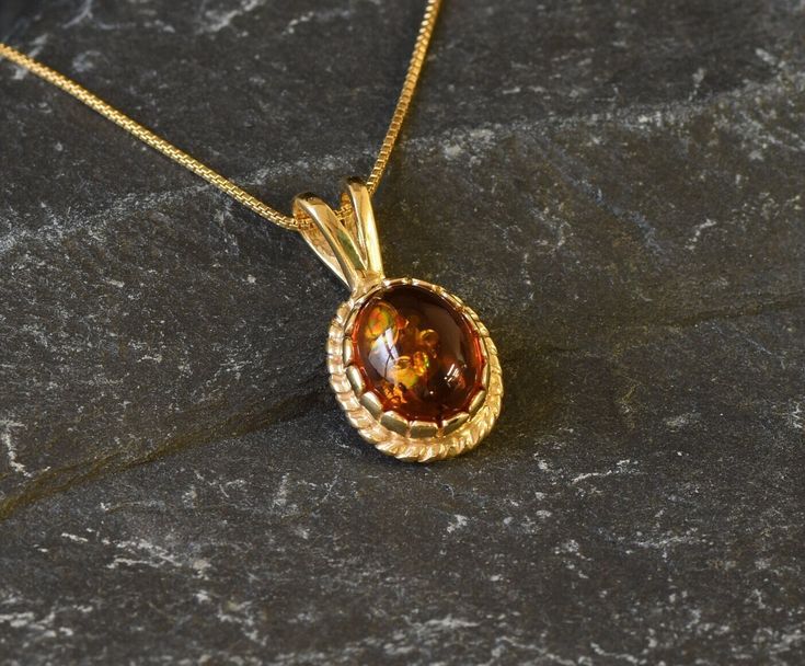 Gold Amber Pendant set with Natural Amber in the highest quality & brownish-yellow translucent resin, at 10x8mm, 3 Carats, sourced from the Europe. Gold Dainty Pendant in Vintage design made  of Gold Vermeil ☞ thickest 18k Gold Plating on top of Solid 925 Sterling Silver ☞ made to last. Free Gold Vermeil Chain with every Pendant order, 18 inch Silver chain (46 cm) ✓ Matching Ring & Earrings - please ask me ⌛Last Pendant left ⌛  ❀ Each Natural Gem is unique & will have Slight variations from the Brown Oval Jewelry For Anniversary, Oval Brown Jewelry For Anniversary, Formal Oval Amber Necklace, Oval Baltic Amber Gold Jewelry, Gold Baltic Amber Round Necklace, Gold Baltic Amber Necklace, Classic Oval Baltic Amber Jewelry, Oval Amber Jewelry, Morganite Pendant