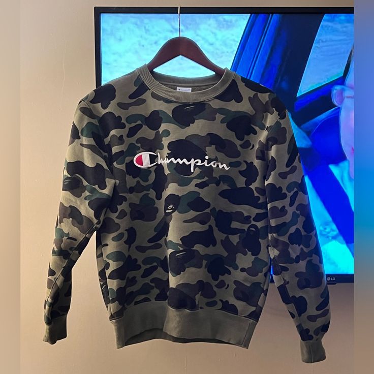 This Item Is Marked As Medium, But Bathing Ape Goes By Asian Sizing, So It’s More Suited To A Xs-S. Very Good Condition, Bought Secondhand And Checked It For Marks I Kind Of Saw One By The End Of The “Champion” Logo, But Nothing Major. Limited Collab From 2016, Pretty Well Coveted On The Market. Never Worn By Me. 100% Authentic. Camouflage Cotton Crew Neck Sweatshirt, Camouflage Crew Neck Tops For Winter, Winter Camouflage Crew Neck Tops, Bape Shirt, Camo Sweatshirt, Champion Logo, Bathing Ape, A Bathing Ape, The End