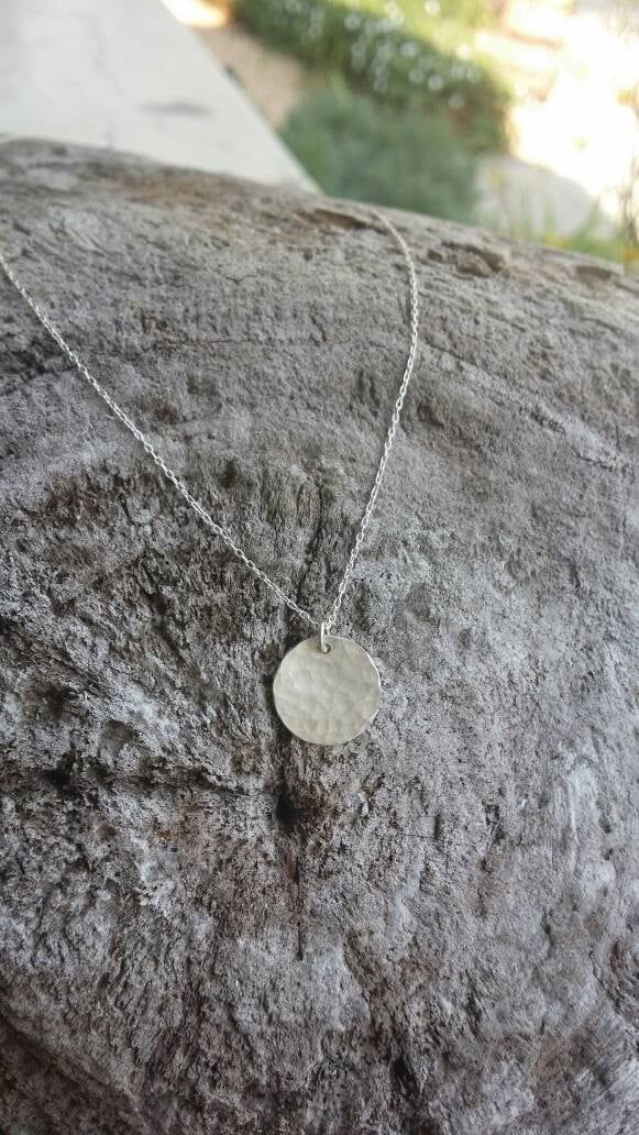 This small sterling silver necklace is perfect for layering! The 12mm solid sterling silver charm is hammered to give a fun effect, and shown here hanging from a 20 inch sterling silver chain, layered on bottom, with our tiny 9mm version in 17 inch length on top. We also have a larger 22mm size available as seen in the triple layer picture. Can also be made in gold fill as seen in the last photo. *Please note that this is for the 12mm disk necklace only. The other sizes are shown for comparison Hammered Sterling Silver Jewelry Gift, Sterling Silver Hammered Jewelry Gift, Sterling Silver Stamped Round Necklace, Hammered Sterling Silver Jewelry For Gifts, Minimalist Stamped Sterling Silver Charm Necklaces, Minimalist Stamped Sterling Silver Charm Necklace, Silver Sterling Silver Coin Necklace As Gift, Silver Circle Sterling Silver Charm Necklace, Silver Sterling Silver Circle Charm Necklace