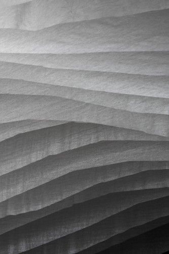 an abstract photo of wavy white paper