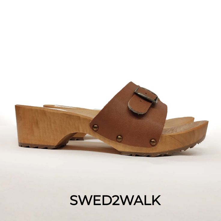 Swedish Clogs Mules Casual Wooden Clogs With Wooden Heel, Wooden Closed Toe Clogs With Wooden Heel, High Heel Clogs With Cork-bed Midsoles, Closed Toe Mules With Wooden Heel, Brown Rubber Sole Clogs For Summer, Brown Summer Clogs With Rubber Sole, Summer Brown Clogs With Rubber Sole, Wooden Platform Clogs With Round Toe, Casual Closed Toe Wooden Clogs