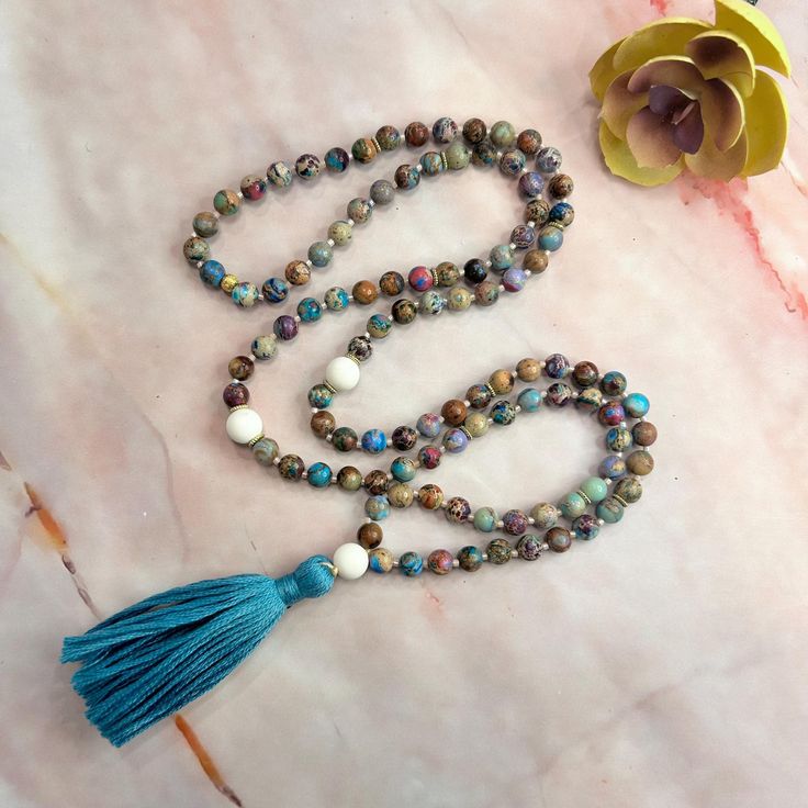 ✨Hello! There's a reason you found us--our handmade Malas, crafted with love and genuine gemstones, are here to bring peace and purpose to your journey. The Mala meant for you will naturally shine through. Trust the Mala you are being guided to.  ◈ Whats included:  Each Mala purchase comes with a card detailing the stone's healing properties, a mantra card, meditation instructions, and a beautiful burlap bag for storage--no gift wrap needed ◈  ◈ What is a Mala?  Malas are traditionally used for Bohemian Mala With 108 Beads For Meditation, Bohemian 108 Beads For Meditation, Hippie Jewelry With 108 Beads For Meditation, Bohemian Mala With 8mm Beads For Healing, Bohemian Mala With 8mm Beads For Meditation, Bohemian Hand-strung Mala For Meditation, Adjustable Bohemian Mala For Healing, Bohemian Hand Knotted Mala For Meditation, Multicolor 108 Beads Mala For Meditation