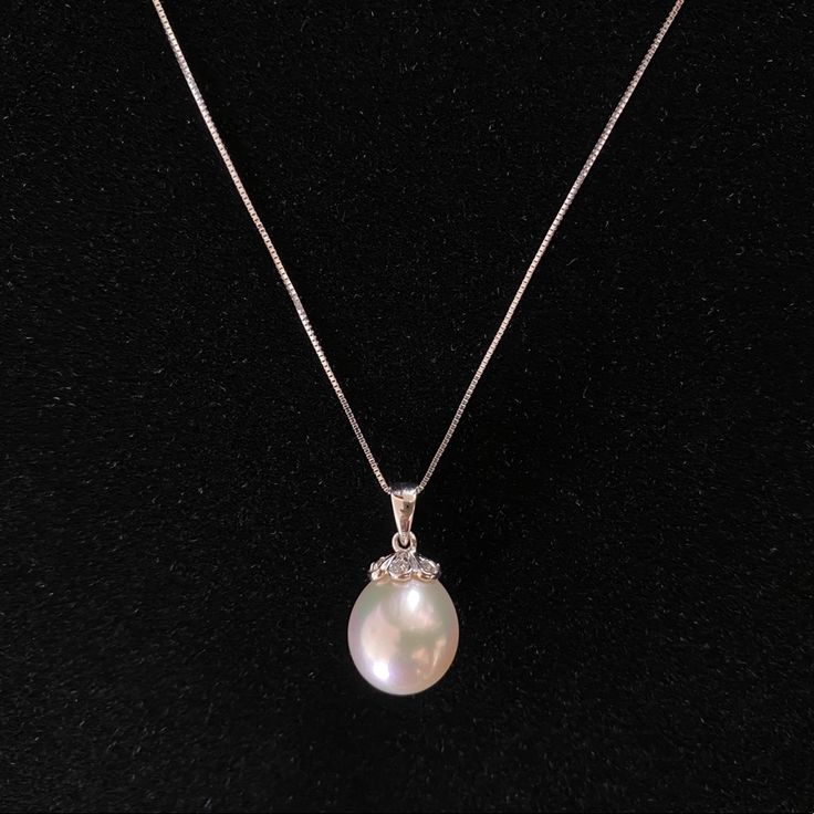 New With Tag And Flawless - Stored In Jewelry Box, Never Worn. Purchased In Store Directly From The Fine Jewelry Section At Macy’s. Does Not Come With Original Packaging, But Will Be Packed Safely For Shipment. This Is An Absolutely Beautiful Pendant. The Pearl Is Lustrous And A Nice Size To Wear As A Pendant Alone. Unfortunately I Haven’t Made Use Of It. Pearl Size: 12mm (L) X 10mm (W) Pendant Overall Length (Including Bail) : 20mm Delicate 18” 14k White Gold Box Chain. 6 Diamonds Set At Crown Elegant Pear-shaped Rose Gold Necklace, Elegant Oval Sterling Silver Pearl Necklace, Elegant Formal Jewelry From Macy's, Elegant Pear Shaped Necklace With Diamond Accents, Elegant Pear-shaped Necklace With Diamond Accents, White Pear-shaped Jewelry For Formal Occasions, Timeless White Pear-shaped Necklace, Elegant Oval Necklace For Evening, Elegant Macy's Jewelry For Formal Occasions