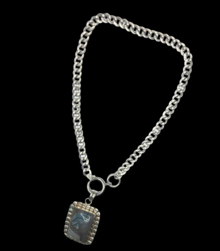 Heavy Sterling Silver Necklace featuring Gorgeous Bezel Set Blue Agate Pendant presented on solid Italian Chain.  I love how this chain undulates with the movement of my neck and the endless possibilities of  pendants I can wear.  The Agate is not only Bezel set, but surrounded by an attractive dot design and hallmarked 925 on the back.   Due to the thickness of the Chain, the Pendant is attached to the secure Closure of the Necklace. Pendant:  1 1/2" x 1 1/4" Necklace length: 16" Weight:  43 g, Italian Chain, Agate Pendant Necklace, Dots Design, Blue Agate, Agate Pendant, Necklace Length, Endless Possibilities, Bezel Setting, Necklace Pendant