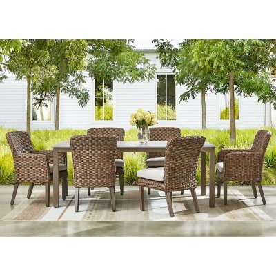 an outdoor dining table and chairs set