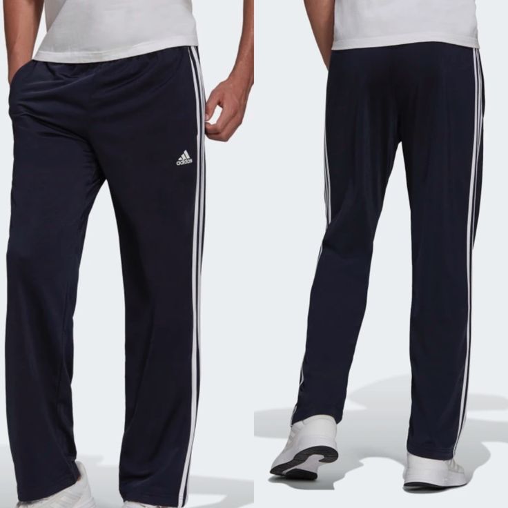 Adidas Primegreen Essentials Warm-Up Open Hem 3-Stripes Track Pants Blue New Rock A Sporty Look While Warming Up Or Relaxing. These Versatile Track Pants Have An Iconic 3-Stripes Look And An Open Hem. Cinch Down The Drawcord On The Elastic Waist For A Secure Fit When You're Hustling Across Town Or Playing Catch In The Park. This Product Is Made With Primegreen, A Series Of High-Performance Recycled Materials. Regular Fit Elastic Waist With Drawcord 100% Recycled Polyester Tricot Front Pockets Op Adidas Jogging Bottoms With Three Stripes, Adidas Jogging Bottoms With Side Stripes, Adidas Bottoms With Side Stripes For Jogging, Adidas Sporty Bottoms With Contrast Stripes, Sporty Cotton Pants With Three Stripes, Athleisure Full-length Bottoms With Three Stripes, Athleisure Full Length Bottoms With Three Stripes, Casual Adidas Pants With Side Stripes, Blue Sporty Bottoms With Contrast Stripes