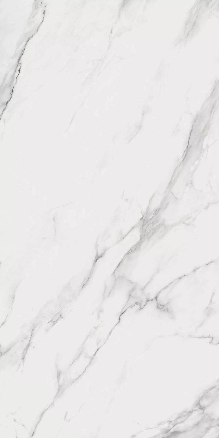 a white marble textured surface with black and silver accents on the top right corner