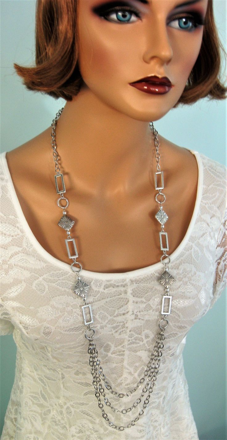 Multi Strand Silver Chain Beaded Necklace for Women. Handmade Jewlery for women by Ralston Originals. I made this beautiful long silver beaded necklace with large silver metal square and circle links, large antique silver metal beads, small round silver metal beads, and silver metal chain, with 3 multi strands at the bottom of the necklace. This long necklace is 40 inches, and has a lobster clasp. This necklace can be made shorter with fewer links. This silver necklace is ready to send today, an Elegant Beaded Necklace With Silver Chain As Gift, Metal Beaded Necklaces With Silver Chain For Gifts, Gift Metal Beaded Necklaces With Silver Chain, Gift Beaded Necklace With Silver Chain, Gift Metal Beaded Necklace With Silver Chain, Elegant Silver Beaded Chain Necklace, Beaded Necklace With Silver Chain, Metal Long Necklace With Silver Chain For Gifts, Silver Beaded Necklace With Silver Chain As Gift