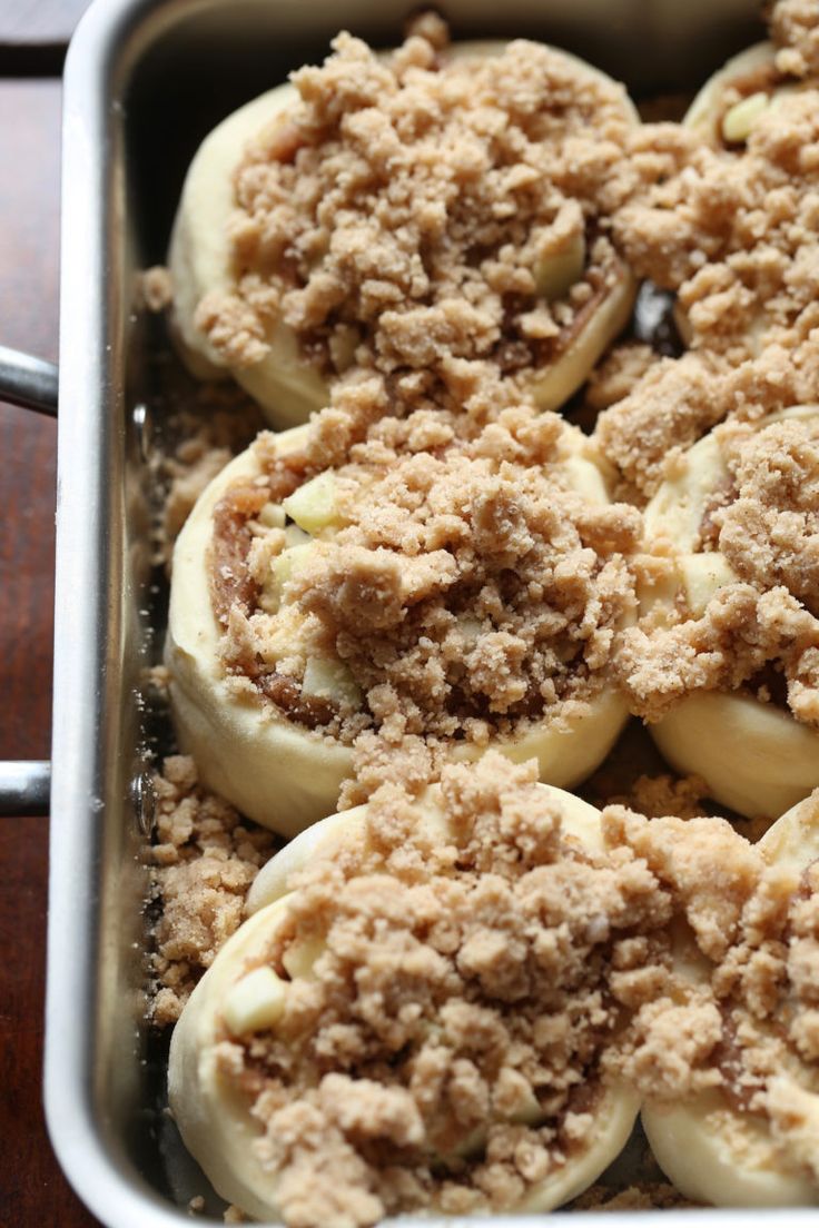 baked pastries in a baking pan with crumbs on top