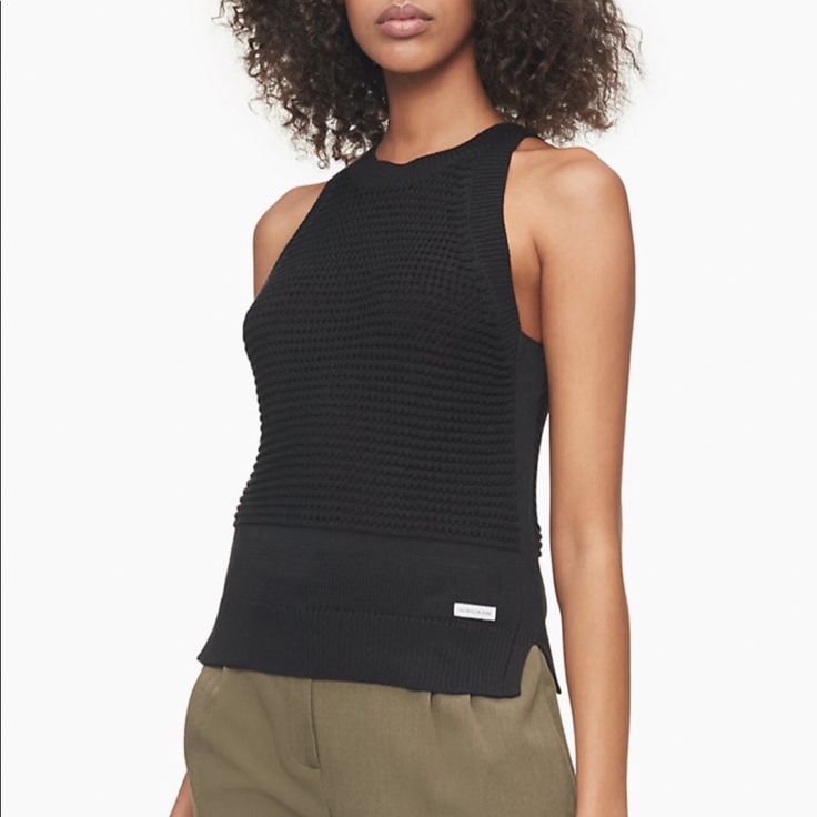 Featuring An Open Stitch Knit Construction, This Airy Sleeveless Sweater Is A Refined Choice For Breezy, Warm Weather Days. Features A Crewneck With A Wide Ribbed Knit Border, An Open Stitch Front And Back With Solid Trim, A Woven Ckj Logo Tag At The Front And A Vented Hem For An Effortless Fit. Black Sweater Vest For Spring, Sleeveless Textured Knit Top For Work, Chic Sleeveless Textured Knit Vest, Black Knit Vest For Workwear, Black Knit Vest For Work, Black Sweater Vest For Summer Layering, Versatile Black Tank Top For Fall, Black Textured Knit Sleeveless Top, Stretch Textured Knit Sleeveless Sweater Vest