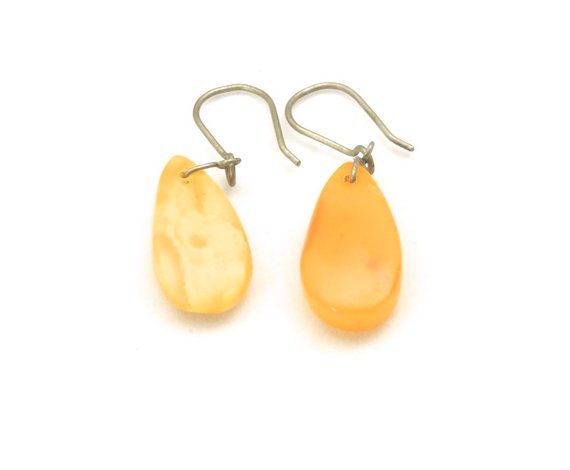 - Pair of old natural butterscotch yolk baltic amber earrings- Amber portion of earrings measure 22.5mm tall by 10.5mm wide and 5mm deep- Together earrings weigh 2.1 grams Classic Yellow Teardrop Earrings, Yellow Baltic Amber Teardrop Jewelry, Hypoallergenic Amber Teardrop Earrings, Baltic Amber Drop Earrings, Classic Yellow Earrings As Gift, Classic Yellow Earrings For Gift, Elegant Yellow Baltic Amber Earrings, Yellow Baltic Amber Earrings, Amber Dangle Earrings In Baltic Amber