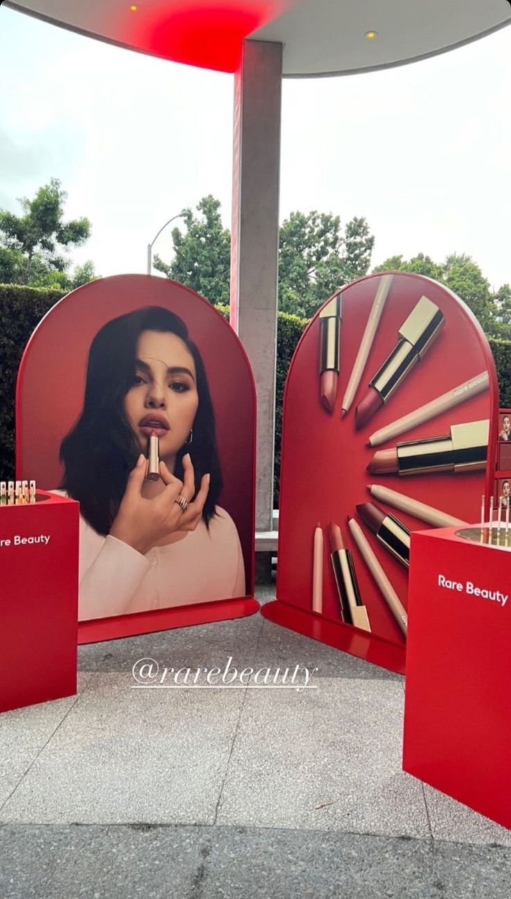 a display with lipstick and makeup products on it