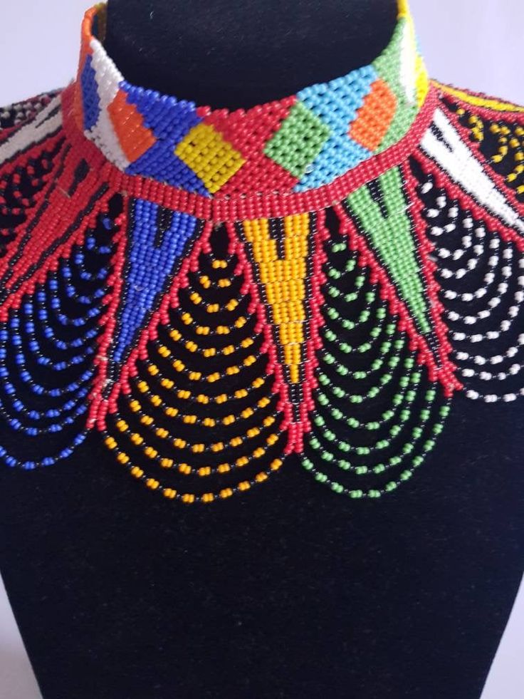 This shoulder necklace is made using colorful fine beads. Perfect for weddings or African themed events. **Buy multiple items and pay shipping for 1 item only.The rest ships free. More neckleces here; https://www.etsy.com/shop/TribalTess?ref=seller-platform-mcnav&section_id=21306083 Back to my shop; https://www.etsy.com/shop/TribalTess?ref=seller-platform-mcnav Wedding Multicolor, Zulu Wedding, African Wedding Jewelry, Diy Necklace Patterns, Jewelry For Wedding, African Beads Necklace, Multicolor Necklace, Shoulder Necklace, Necklace African