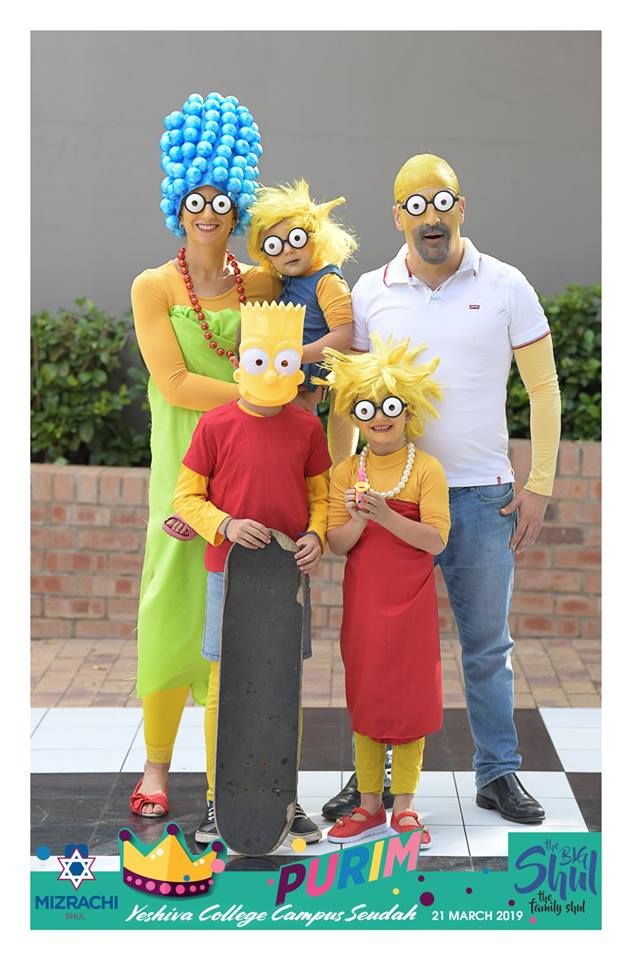 the simpsons family is posing for a photo