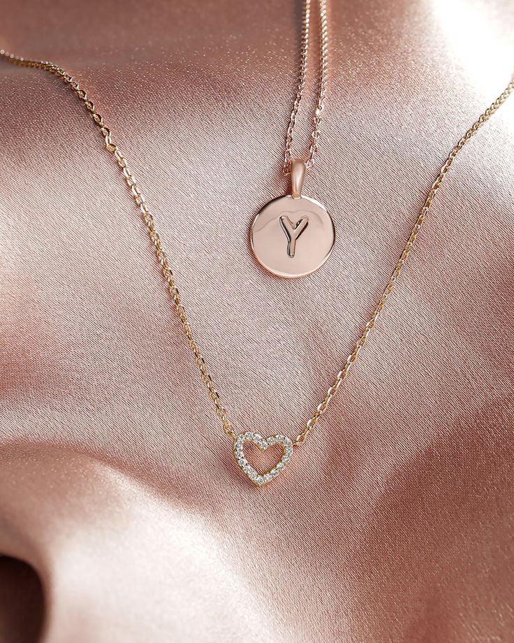 Our open heart pendant is a timeless expression of love. It’s the sweetest gift for yourself or for someone you hold close to show them just how much you care for them. With sparkling cubic zirconia and a dainty chain, this piece is perfectly flirty and feminine. 14KT yellow, rose or white gold platedAAAAA Cubic ZirconiaMeasurements: Diameter: 8mm (.3”)Chain length: 18”+2” extender Mother's Day Rose Gold Heart Necklace With Cubic Zirconia, Dainty Heart Birthstone Necklace For Valentine's Day, Valentine's Day Rose Gold Charm Necklace With Delicate Chain, Valentine's Day Dainty Heart Birthstone Necklace, Rose Gold Heart Necklace With Clavicle Chain, Delicate Round Pendant Jewelry For Valentine's Day, Dainty Heart Necklace With Heart Charm, Dainty Diamond Initial Necklace For Gift, Dainty Diamond Initial Necklace Gift