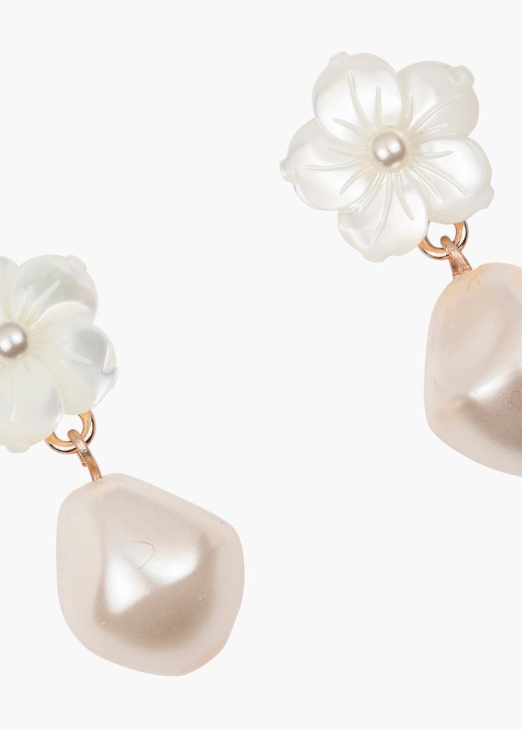 The Mina Earrings pair two of our favorite things: flowers and glowing pearls to create a style that is incredibly versatile. A single baroque crystal pearl falls from a central mother of pearl flower, adding a subtle length and sense of movement. These luminous earrings make styling effortless, no matter the occasion. Discover more of our earring silhouettes. Luxury Hair Accessories, Luxury Hair, Pearl Flower, Crystal Pearls, Baroque Pearls, Rhodium Plated, Post Earrings, Mother Of Pearl, Favorite Things