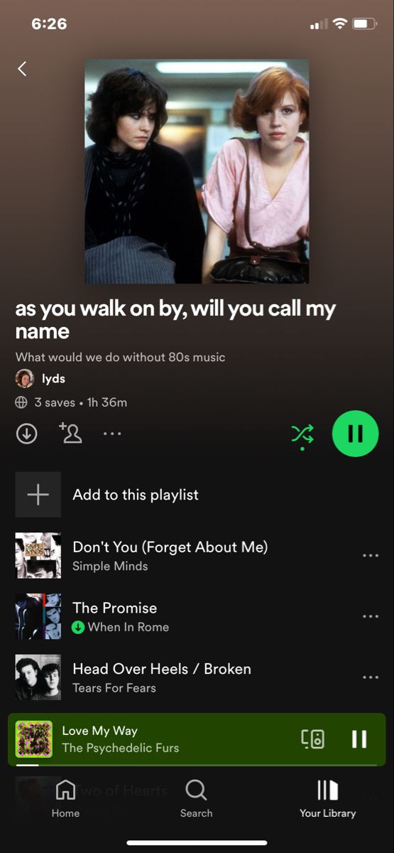 the music player on an iphone screen with two people talking to each other and one person holding