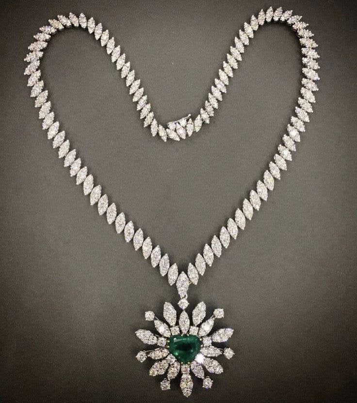 Handmade Item Recycling: No Necklace weight: 32.200 Grams Necklace Length: 18.00 Inches Necklace width : 4.50 Inches Gemstone: American Zirconia & Emerald Zirconia weight: 8.20 Carats Zirconia colure: White Zirconia shape: Round & Marquise Material: Silver Silver Purity: 925 Stone putting : Prongs Emerald weight: 5.80 Carats Emerald : Lab created Necklace Finished: White Luxury Pear-shaped Diamond Emerald Necklace, Luxury Pear-shaped Emerald Necklace With Diamonds, Luxury Pear-shaped White Gold Emerald Necklace, Luxury Pear-shaped Emerald Necklace In White Gold, Luxury White Gold Emerald Diamond Necklace, Dazzling Pear-shaped Embellished Necklace, Dazzling Pear-shaped Necklace With 17 Jewels, Heart Cut Diamond White Necklace With 17 Jewels, Formal Brilliant Cut Diamond Emerald Necklace