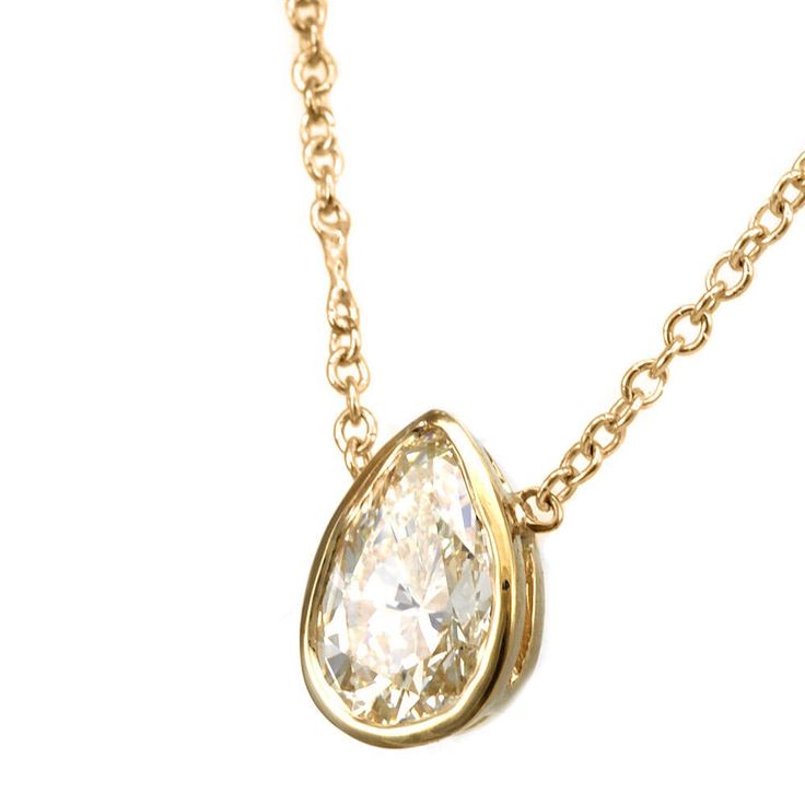 "This framed bezel design pendant complimented with Pear Shape Diamond is hand crafted and cast in solid 14K yellow gold.  Chain is included. COMPONENT DIAMOND: 1 Pear Shape Diamond center CARAT WEIGHT:  0.50ct COLOR/CLARITY: G - H / SI METAL:  14K Yellow Gold  GRAM WEIGHT:  1.5gr WIDTH:  7.6  x 5.3mm DEPTH:  3.0mm  LENGTH: 16\" (including chain) STYLE CODE: NK3612-DIS All of our items are made in the U.S.A. For your other preferences, simply contact us. To see more of my necklaces: https://www. Luxury Pear-shaped Yellow Gold Diamond Necklace, Yellow Gold Teardrop Jewelry With Bezel Setting, Timeless Teardrop Bezel Set Jewelry, Classic Bezel-set Teardrop Pendant Jewelry, Pear-shaped Bezel Setting Fine Jewelry Necklace, Classic Teardrop Pendant Jewelry With Bezel Setting, Classic Teardrop Pendant With Bezel Setting, Formal Drop Necklace With Bezel Setting, Formal Drop Jewelry With Bezel Setting