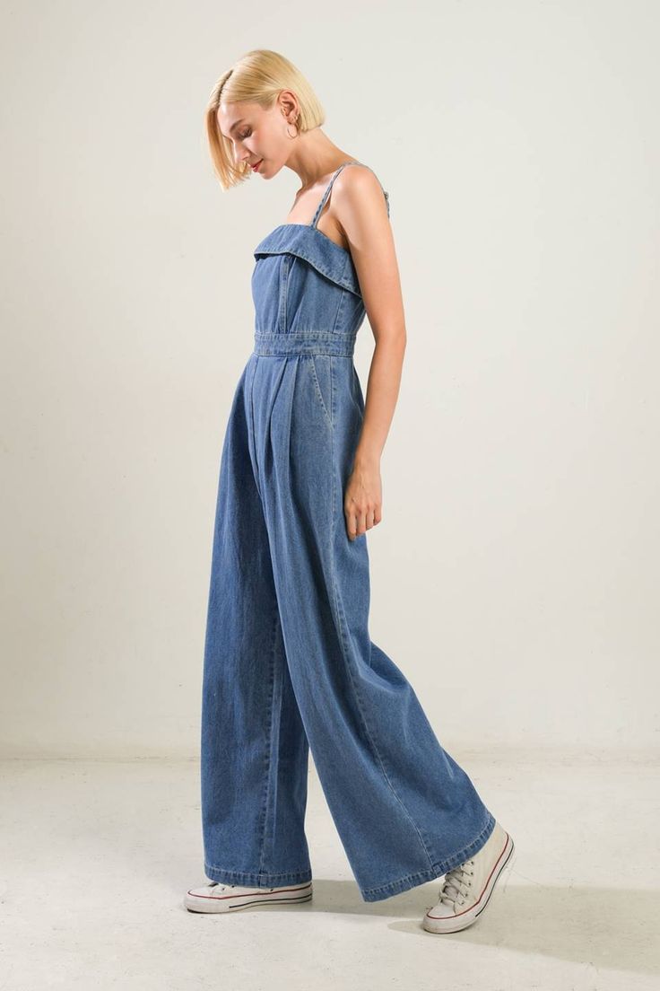 A washed denim jumpsuit featuring straight neckline, straps, front pleats, side pockets, wide leg and back zipper closure Details: Self : 90% Cotton 10% Polyester Size & Fit - Model is 5`8" And Wearing Size Small- Measurements Taken From Size Small- Approx. Length: 60" Casual Denim Strapless Jumpsuit In Medium Wash, Summer Light Wash Wide Leg Denim Jumpsuit, Light Wash Wide Leg Denim Jumpsuit For Summer, Casual Medium Wash Strapless Jumpsuit For Spring, Casual Strapless Jumpsuit In Medium Wash For Spring, Casual Strapless Jumpsuit For Spring In Medium Wash, Summer Wide Leg Medium Wash Denim Jumpsuit, Casual Denim Blue Strapless Overall Jumpsuit, Casual Denim Strapless Jumpsuit With Pockets