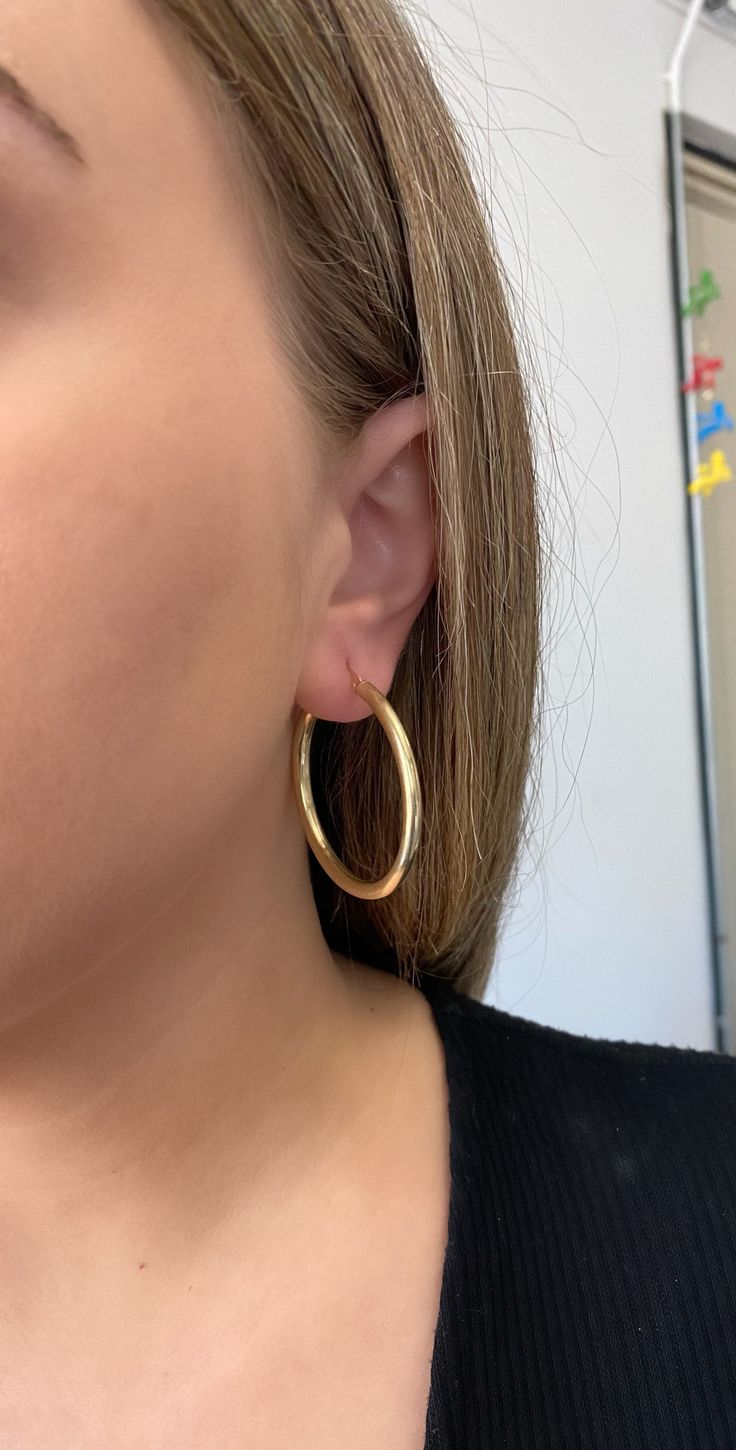 14k solid gold hoop earrings. 2.25 inch hoops. Material: Genuine 14k solid gold. Length: approximately 2.25 inches long. Width: approximately 3.5mm wide. Weight: approximately 5 grams. Comes in a nice box. Cadmium-free Jewelry For Formal Occasions, Cadmium-free Formal Jewelry, Classic Cadmium-free Yellow Gold Jewelry, Yellow Gold Hoop Earrings With Ear Wire, 14k Gold Hoop Earrings Stamped 14k, Classic 14k Stamped Hoop Jewelry, Classic Cadmium-free Hoop Jewelry, Oval 14k Gold Hypoallergenic Hoop Earrings, Gold Plated Hoop Jewelry Stamped 14k