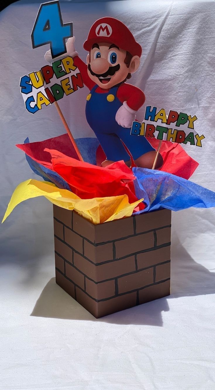 a super mario birthday cake in a box