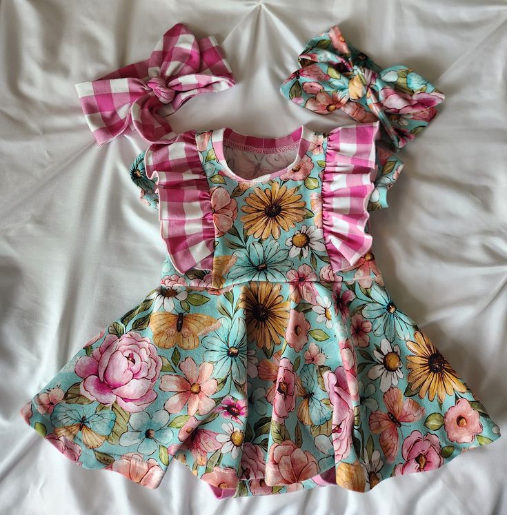 This absolutely darling floral ruffle dress is the perfect baby girl or toddler dress. Now available in 2 more fabric options! It has a full circle skirt.  Made out of soft cotton knit fabric, your baby will be so comfortable in it!  It has super cute ruffles and comes with or without an attached bodysuit. Pair with the matching headbands for the perfect baby shower gift! if you order the whole set, you get both headbands included. Comes ready to gift in an organza bag. I make each of these in m Pink Ruffle Twirl Dress For Spring, Pink Ruffled Twirl Dress For Spring, Playful Pink Twirl Dress With Flutter Sleeves, Pink Twirl Dress With Flutter Sleeves For Spring, Cute Pink Twirl Dress With Flutter Sleeves, Pink Floral Print Twirl Dress For Playtime, Pink Ruffle Twirl Dress For Garden Party, Pink Ruffled Twirl Dress For Garden Party, Playful Pink Floral Print Twirl Dress