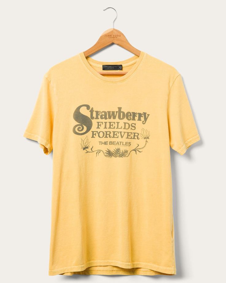 One, two, three, four check out our brand new The Beatles Strawberry Fields Forever Vintage Tee! Our vintage tee is a staple of our brand. Featuring the stunning Yolk Yellow colorway, a trendy oversized fit, a one-of-a-kind graphic, and made of our 100% lightweight cotton. This tee will surely turn heads wherever you wear it. Vintage T-shirt For Spring Streetwear, Vintage Text Print T-shirt For Spring, Retro Cotton T-shirt For Spring, Vintage Crew Neck T-shirt With Text Print, Retro Cotton Tops With Graphic Print, Vintage Graphic Print Short Sleeve T-shirt, Vintage Letter Print Tops For Spring, Vintage Acid Wash Cotton T-shirt, Vintage Style T-shirt For Spring Streetwear