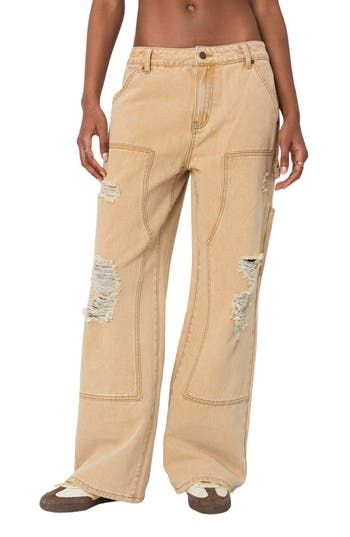 A vintage-inspired take on the utility trend, these distressed nonstretch carpenter jeans feature a low-rise waist, full-length wide legs and a paneled design. Zip fly with button closure Five-pocket style; tool pockets; hammer loop 100% cotton Machine wash, dry flat Imported Fall Ripped Cargo Jeans, Spring High Rise Distressed Cargo Jeans, Spring Distressed Medium Wash Cargo Jeans, Spring Season Distressed Medium Wash Cargo Jeans, Distressed Wide Leg Cargo Jeans For Fall, Distressed Mid-rise Utility Bottoms, Distressed Utility Mid-rise Bottoms, Distressed Brown Straight Leg Jeans, Brown Distressed Straight Leg Jeans