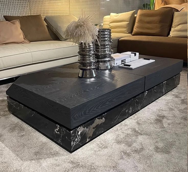 a living room with couches and a coffee table in the middle on carpeted flooring