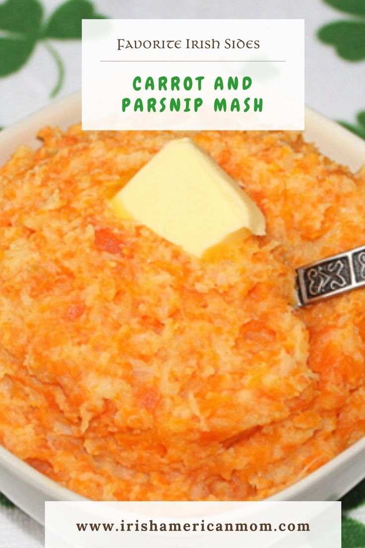 carrot and parsnip mash in a bowl with a piece of butter on top