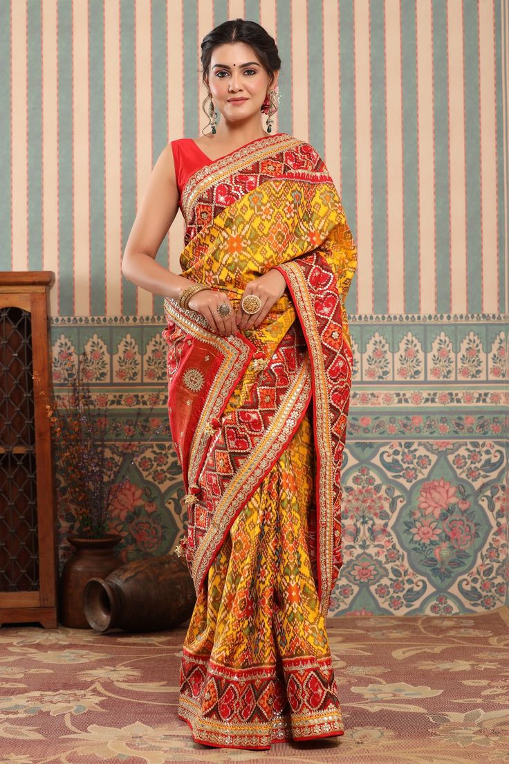 Buy yellow Patola silk sari online in USA with red embroidered border. Make a fashion statement at weddings with stunning designer sarees, embroidered sarees with blouse, wedding sarees, handloom sarees from Pure Elegance Indian fashion store in USA.-full view Patola Silk Saree, Wedding Sarees, Pure Elegance, Fashion Journals, Embroidered Border, Traditional Fabric, Silk Sari, Handloom Saree, Blouse Dress