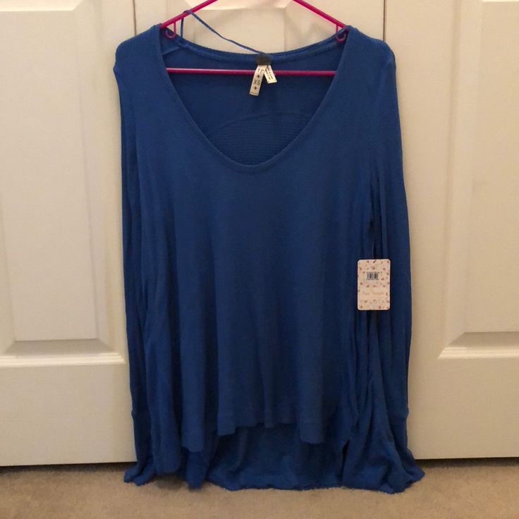 Free People Long Sleeve Blue Thermal Tee. Slight High/Low Hem, Wide U-Neck Line And Thumb Hole Detail. Casual Blue T-shirt For Layering, Blue T-shirt For Summer Layering, Blue Casual Long Sleeve Top For Fall, Casual Blue Long Sleeve Top For Fall, Trendy Blue Tops For Loungewear, Blue V-neck T-shirt For Loungewear, Blue Stretch Tops For Loungewear, Casual Blue Stretch Blouse, Casual Blue Long Sleeve Top For Layering