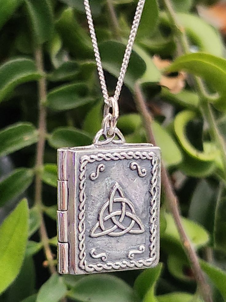 "Book of Shadows Triquetra Grimoire Locket Pendant 20\" Curb Chain Necklace  925 Sterling Silver Talisman Amulet Pagan Wiccan (WPSLP) 13gram Approx 28mm x 18mm x 5mm Item has a filigree corners. The book has a clasp closure and also as pictured illusion pages around the edge FREE GIFT BOX (May Vary) Your item is 100% Sterling silver and may tarnish as all silver does. It is well known silver reacts with the elements this may be caused by highly acidic perspiration or contact with other chemical Triquetra Necklace, Locket Pendant Necklace, Book Of Shadows, Cleaning Products, Curb Chain, Free Gift, Locket, Free Gifts, Chain Necklace