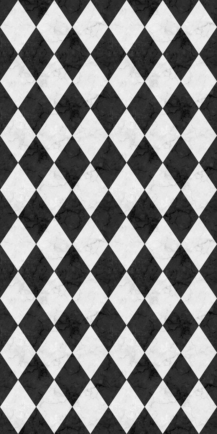 a black and white checkered background with diagonal squares