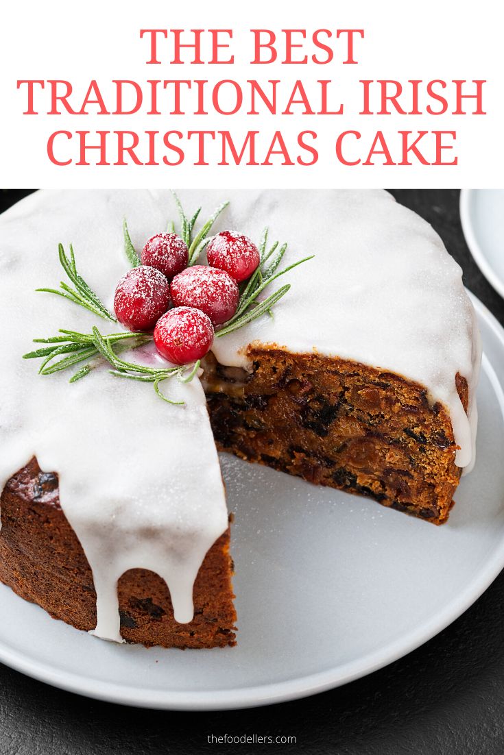 the best traditional irish christmas cake with icing and fresh cranberries on top