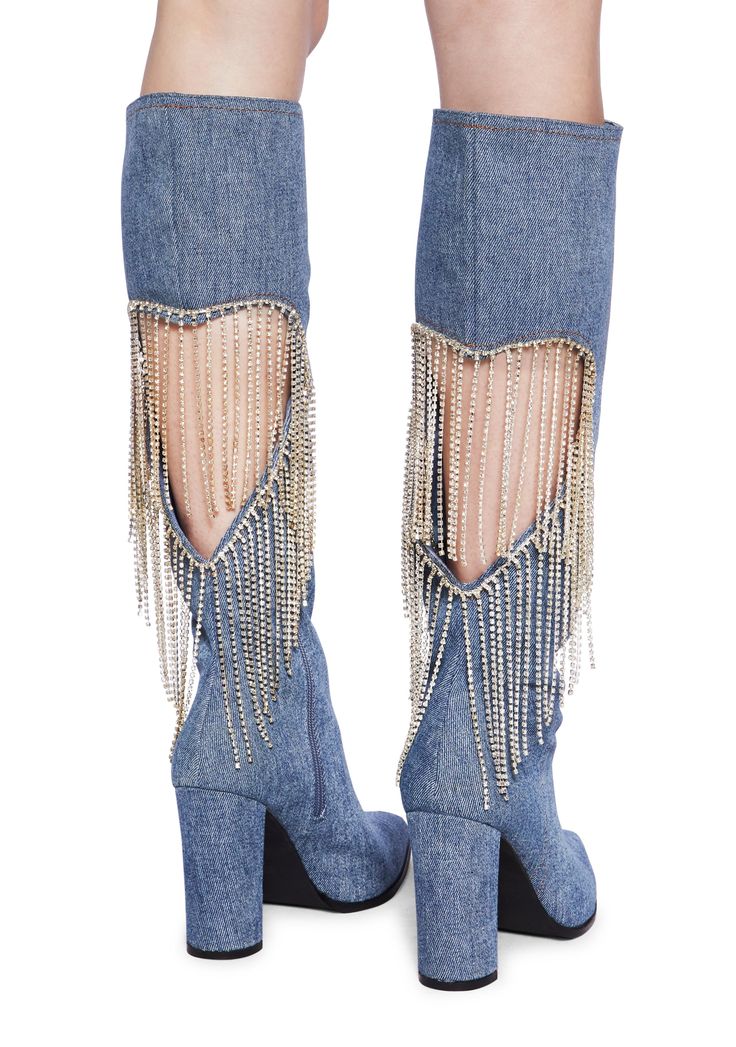 cuz let's party. These boots have a denim construction, a cut out heart design with rhinestone fringe on the back, a pointed toe design, block heels, and side zipper closures. Spring Boots With Rhinestone Fringe, Fall Party Denim Blue Jeans, Trendy Fringe Boots For Party, Trendy Party Boots With Fringe, Chic Denim Blue Jeans For Party, Denim Pointed Toe Boots For Party, Denim Blue Pointed Toe Party Boots, Party Denim Blue Pointed Toe Boots, Party Jeans With Rhinestone Fringe