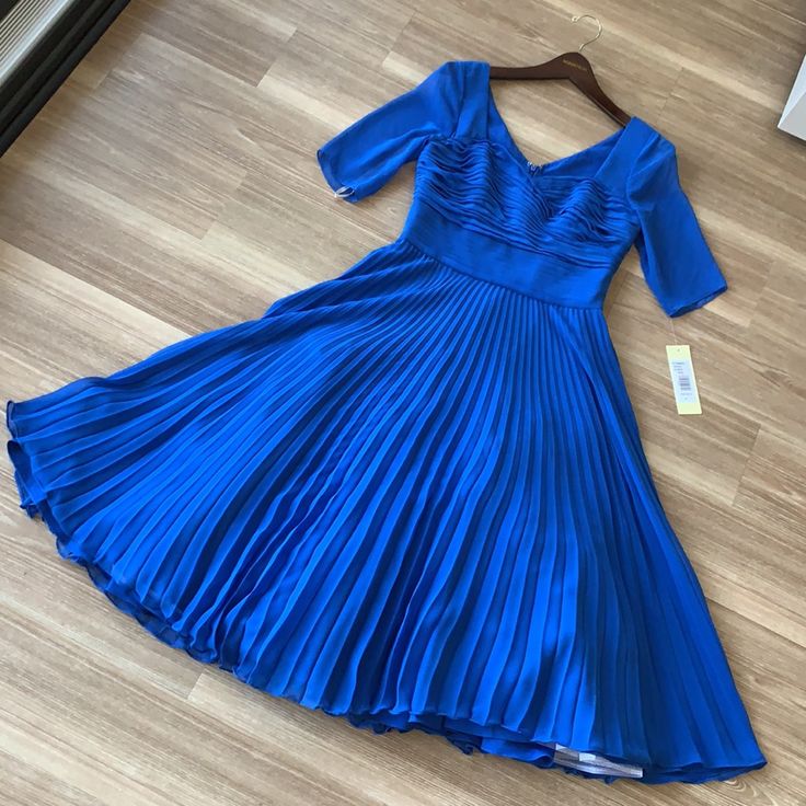 - Designer = Mikael Aghal - Size = 4. Trunk 70 - Msrp =$900 - Color = Royal Blue - Style = Pleated Flared Bottom Short Sleeve Size 4 Dress - Sleeve Length Measured At Seam Of Shoulder Blade To Bottom Tip Of Sleeve = 33cm - Length 4measured At Seam Of Shoulder Blade To Bottom Tip Of Dress = 114cm -Width Measured Across Chest From Seam Of Armpit To The Other = 47cm - Perfect Item For All Of Your Formal Events And Weddings. - Genuine And Authentic Or Your Money 5back Trunk 70 Elegant Royal Blue A-line Dress, Blue Evening Dress With Pleated Back, Blue Pleated Back Dress For Evening, Blue A-line Evening Dress With Pleated Bodice, Blue Pleated Evening Dress For Gala, Royal Blue A-line Fitted Dress, Elegant A-line Royal Blue Dress, Blue A-line Pleated Dress, Blue Dress With Pleated Back And Fitted Bodice