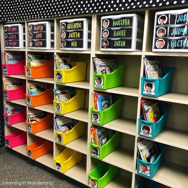 the shelves are filled with colorful bins for children's books to read and write